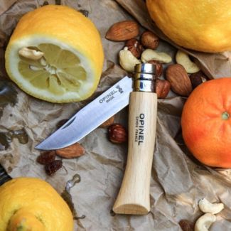 opinel product shot with citrus and nuts