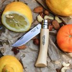opinel product shot with citrus and nuts