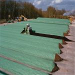 toptex being used to cover rows of compost